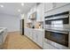 Modern kitchen with stainless steel appliances and white cabinets at 3359 Hanging Tide St, Winter Garden, FL 34787