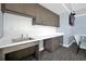 Small kitchenette with sink and cabinets in the community room at 3359 Hanging Tide St, Winter Garden, FL 34787