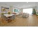 Spacious living room with a large TV, comfortable seating, and a Christmas tree at 3359 Hanging Tide St, Winter Garden, FL 34787