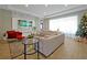 Open living area with modern furniture, large windows, and decorative accents at 3359 Hanging Tide St, Winter Garden, FL 34787