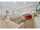 Open floor plan showing living and kitchen areas with stylish furniture at 3359 Hanging Tide St, Winter Garden, FL 34787