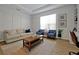 Cozy living room with neutral tones and wood coffee table at 3359 Hanging Tide St, Winter Garden, FL 34787