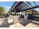 Relaxing pergola with seating near the pool area at 3359 Hanging Tide St, Winter Garden, FL 34787