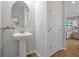 Small half-bath with pedestal sink and simple decor at 3359 Hanging Tide St, Winter Garden, FL 34787