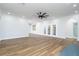 Bright living room with hardwood floors and French doors at 4942 Simmons Rd, Orlando, FL 32812