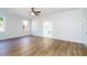 Spacious main bedroom with hardwood floors and ensuite bathroom at 4942 Simmons Rd, Orlando, FL 32812