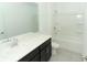 Bathroom with tub shower, dark vanity, and tile flooring at 5021 Bougainvillea Ct, Lake Hamilton, FL 33851