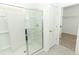 Bathroom with a shower and white tile flooring at 5021 Bougainvillea Ct, Lake Hamilton, FL 33851