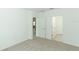 Bedroom with access to bathroom and carpet flooring at 5021 Bougainvillea Ct, Lake Hamilton, FL 33851