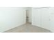 Bedroom with double door closet and carpet flooring at 5021 Bougainvillea Ct, Lake Hamilton, FL 33851