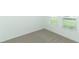 Bright bedroom with carpet flooring and large windows at 5021 Bougainvillea Ct, Lake Hamilton, FL 33851
