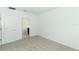Bedroom with access to a bathroom and carpet flooring at 5021 Bougainvillea Ct, Lake Hamilton, FL 33851