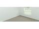 Well-lit bedroom featuring neutral wall and carpet at 5021 Bougainvillea Ct, Lake Hamilton, FL 33851