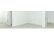 Empty room with tiled floor, white walls, and doors to other rooms at 5021 Bougainvillea Ct, Lake Hamilton, FL 33851