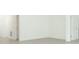 Empty room with tiled floor, white walls, and doors to other rooms at 5021 Bougainvillea Ct, Lake Hamilton, FL 33851