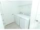 Laundry room with washer, dryer, and shelving at 5021 Bougainvillea Ct, Lake Hamilton, FL 33851