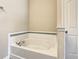 Bathroom with large garden tub and tile details at 5303 Wildwood Way, Davenport, FL 33837