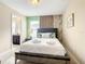 Bedroom with a queen bed, and en-suite bathroom access at 5303 Wildwood Way, Davenport, FL 33837