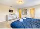 Main bedroom with large dresser, walk-in closet, and ensuite bathroom at 5303 Wildwood Way, Davenport, FL 33837