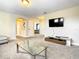 Bonus room features a large TV, entertainment center and comfortable seating at 5303 Wildwood Way, Davenport, FL 33837
