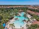 Aerial view of community pool and clubhouse at 5303 Wildwood Way, Davenport, FL 33837