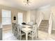 Dining room with a spacious table, ample light, and modern decor at 5303 Wildwood Way, Davenport, FL 33837