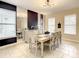Elegant dining room, featuring a large table and stylish wall decor at 5303 Wildwood Way, Davenport, FL 33837