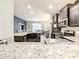 Modern kitchen with stainless steel appliances and granite countertops at 5303 Wildwood Way, Davenport, FL 33837