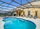 Large screened pool and spa with plenty of lounge space at 5303 Wildwood Way, Davenport, FL 33837