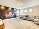 Dedicated theater room featuring a sectional sofa, coffee table, and large screen at 5303 Wildwood Way, Davenport, FL 33837
