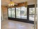 Sunroom with tiled floor, ceiling fan, and view of backyard at 536 Fourwind St, Deltona, FL 32725