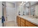 Double vanity bathroom with granite countertops and a walk-in shower at 541 Cantabria Dr, Davenport, FL 33837