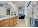 Double vanity bathroom with granite countertops and a view of the bedroom at 541 Cantabria Dr, Davenport, FL 33837