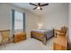 Bedroom with wood-framed bed, ceiling fan, and adjacent closet at 541 Cantabria Dr, Davenport, FL 33837