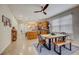 Casual dining area with a rustic live-edge wood table and seating at 541 Cantabria Dr, Davenport, FL 33837