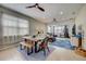 Bright dining area features a live-edge table and bench, creating a warm and inviting space at 541 Cantabria Dr, Davenport, FL 33837