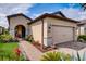 Charming one-story house with a brick walkway and lush landscaping at 541 Cantabria Dr, Davenport, FL 33837