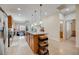 Open kitchen with island, granite counters, and stainless steel appliances at 541 Cantabria Dr, Davenport, FL 33837