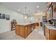 Spacious kitchen features granite countertops, stainless steel appliances and large island at 541 Cantabria Dr, Davenport, FL 33837