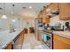 Modern kitchen with stainless steel appliances and ample cabinet space at 541 Cantabria Dr, Davenport, FL 33837