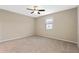 Large bedroom with ceiling fan and neutral decor at 659 Fortanini Cir, Ocoee, FL 34761