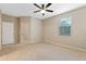 Well-lit bedroom featuring a ceiling fan and ample space at 659 Fortanini Cir, Ocoee, FL 34761