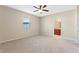 Bright bedroom with ceiling fan and access to bathroom at 659 Fortanini Cir, Ocoee, FL 34761