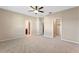 Spacious bedroom with ceiling fan and walk-in closet at 659 Fortanini Cir, Ocoee, FL 34761