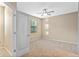 Bright bedroom with ceiling fan and neutral carpeting at 659 Fortanini Cir, Ocoee, FL 34761
