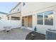 Private patio with pavers and small seating area at 659 Fortanini Cir, Ocoee, FL 34761