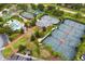 Community overview featuring tennis courts and a clubhouse at 7593 Gathering Dr # 802, Reunion, FL 34747
