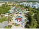 Aerial view of community pool, water park, and resort amenities at 7593 Gathering Dr # 802, Reunion, FL 34747