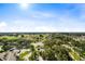 Stunning aerial view of a community with golf course and lush landscaping at 7593 Gathering Dr # 802, Reunion, FL 34747