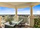 Relaxing balcony with seating and scenic views at 7593 Gathering Dr # 802, Reunion, FL 34747